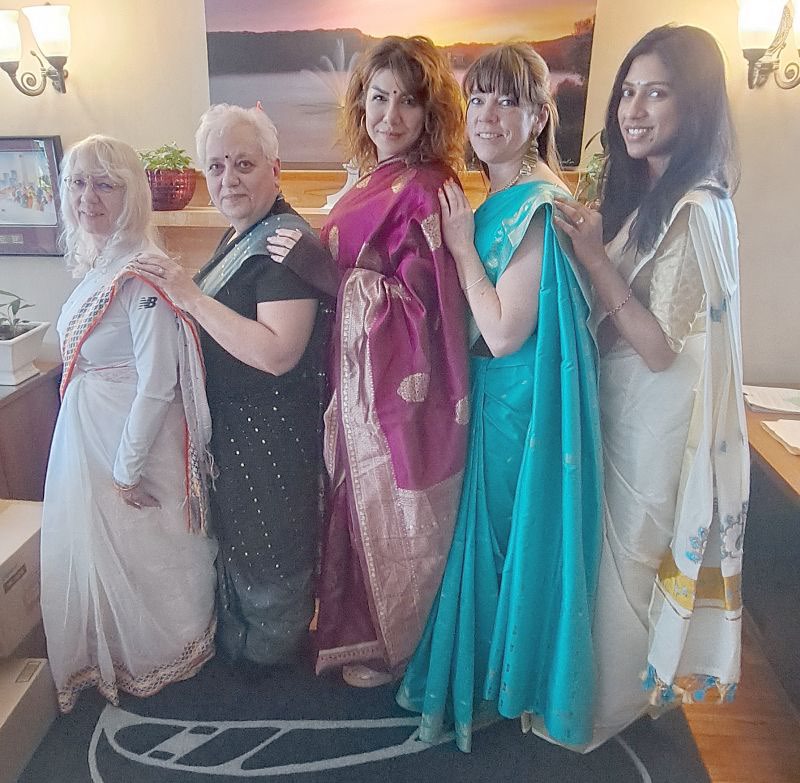 Financial Decisions staff dressed in traditional saris